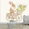 królik na rowerze